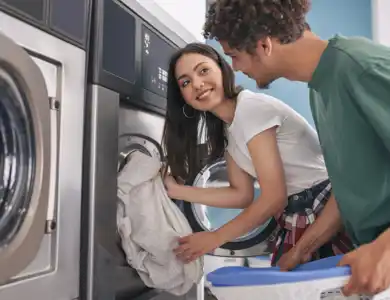Woman Doing Laundry Talking To Man